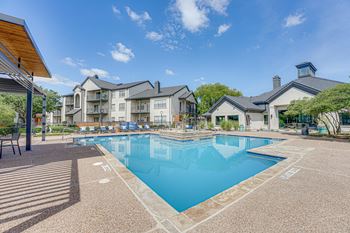 Swimming pool with sundeck and clubhouse building